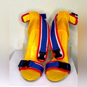 Dominantly yellow sports heel. Size 5.5 suede 2-4 inch stiletto heel.